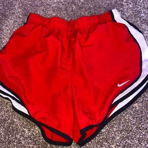 red nike shorts